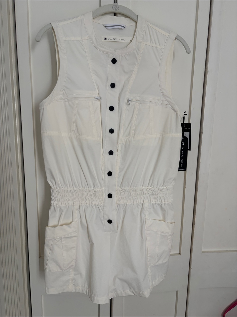 blanc noir Cream Sleeveless Utility Romper Dress with Black snap buttons